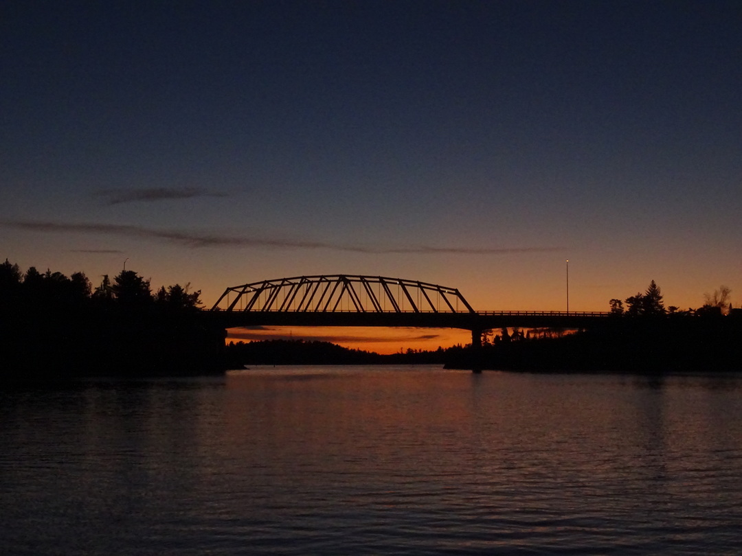 Sun sets behind the Sioux Narrows Bridge, Images of Northwest Ontario